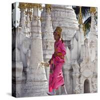 Myanmar, Burma, Lake Inle, A Young Novitiate Passes an Ornate Buddhist Shrine-Nigel Pavitt-Stretched Canvas