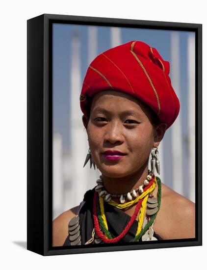 Myanmar, Burma, Loikaw; a Kayah Girl in Front of Ceremonial Posts at Chitkel Village-Katie Garrod-Framed Stretched Canvas