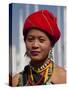 Myanmar, Burma, Loikaw; a Kayah Girl in Front of Ceremonial Posts at Chitkel Village-Katie Garrod-Stretched Canvas