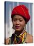 Myanmar, Burma, Loikaw; a Kayah Girl in Front of Ceremonial Posts at Chitkel Village-Katie Garrod-Stretched Canvas