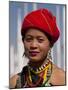 Myanmar, Burma, Loikaw; a Kayah Girl in Front of Ceremonial Posts at Chitkel Village-Katie Garrod-Mounted Photographic Print