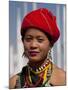 Myanmar, Burma, Loikaw; a Kayah Girl in Front of Ceremonial Posts at Chitkel Village-Katie Garrod-Mounted Photographic Print