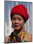 Myanmar, Burma, Loikaw; a Kayah Girl in Front of Ceremonial Posts at Chitkel Village-Katie Garrod-Mounted Photographic Print