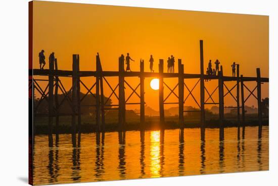 Myanmar. Mandalay. Amarapura. Tourists on the U Bein Bridge at Sunset-Inger Hogstrom-Stretched Canvas