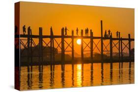 Myanmar. Mandalay. Amarapura. Tourists on the U Bein Bridge at Sunset-Inger Hogstrom-Stretched Canvas