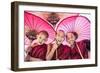 Myanmar, Mandalay Division, Bagan. Portrait of Three Novice Monks under Red Umbrellas (Mr)-Matteo Colombo-Framed Photographic Print