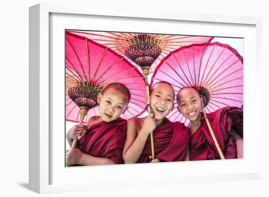 Myanmar, Mandalay Division, Bagan. Portrait of Three Novice Monks under Red Umbrellas (Mr)-Matteo Colombo-Framed Photographic Print