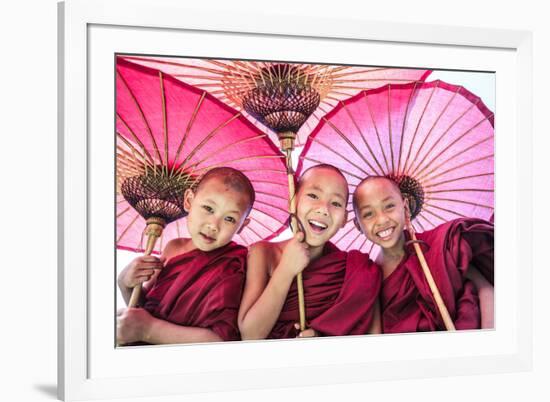 Myanmar, Mandalay Division, Bagan. Portrait of Three Novice Monks under Red Umbrellas (Mr)-Matteo Colombo-Framed Photographic Print