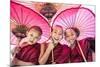 Myanmar, Mandalay Division, Bagan. Portrait of Three Novice Monks under Red Umbrellas (Mr)-Matteo Colombo-Mounted Photographic Print