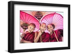 Myanmar, Mandalay Division, Bagan. Portrait of Three Novice Monks under Red Umbrellas (Mr)-Matteo Colombo-Framed Photographic Print