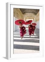 Myanmar, Mandalay Division, Bagan. Three Novice Monks Running with Red Umbrellas in a Walkway (Mr)-Matteo Colombo-Framed Photographic Print