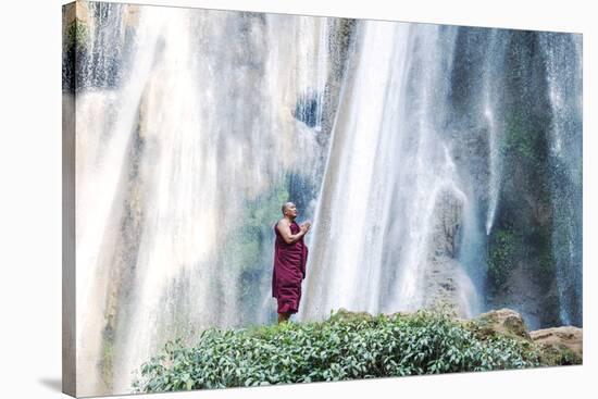 Myanmar, Mandalay Division, Pyin Oo Lwin. Burmese Monk Praying under Dattawgyaik Waterfall (Mr)-Matteo Colombo-Stretched Canvas