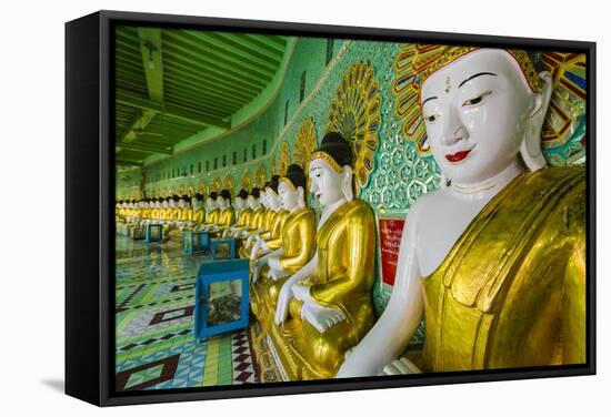 Myanmar. Mandalay. Sagaing Hill. Thirty Caves Temple. Row of Buddhas-Inger Hogstrom-Framed Stretched Canvas