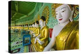 Myanmar. Mandalay. Sagaing Hill. Thirty Caves Temple. Row of Buddhas-Inger Hogstrom-Stretched Canvas