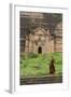 Myanmar, Mingun. a Young Monk Walking Beneath a Massive Temple Wall at Ruins of Mingun Pahtodawgyi-Brenda Tharp-Framed Photographic Print