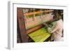 Myanmar. Shan State. Inle Lake. Woman weaving silk at a wooden loom.-Inger Hogstrom-Framed Photographic Print