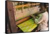 Myanmar. Shan State. Inle Lake. Woman weaving silk at a wooden loom.-Inger Hogstrom-Framed Stretched Canvas