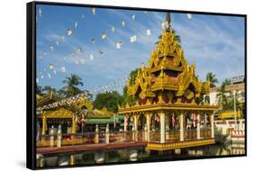 Myanmar. Yangon. Kyay Thone Pagoda. Buddhist Flags in the Breeze-Inger Hogstrom-Framed Stretched Canvas