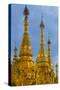 Myanmar. Yangon. Shwedagon Pagoda. Golden Spires Gleam at Twilight-Inger Hogstrom-Stretched Canvas