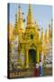 Myanmar. Yangon. Shwedagon Pagoda. Locals Lighting Candles-Inger Hogstrom-Stretched Canvas