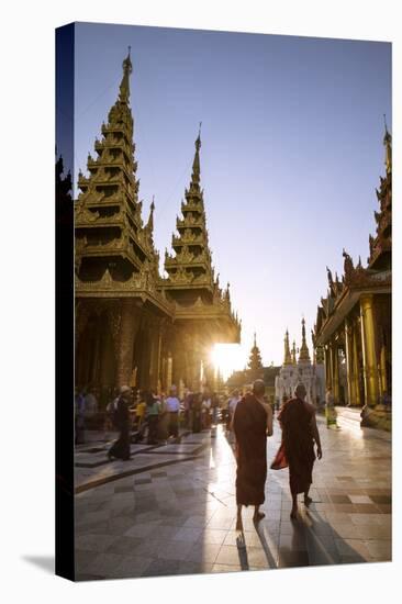 Myanmar, Yangon. Two Buddhist Monks Walking Inside Shwedagon Pagoda Complex at Sunset (Mr)-Matteo Colombo-Stretched Canvas