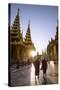 Myanmar, Yangon. Two Buddhist Monks Walking Inside Shwedagon Pagoda Complex at Sunset (Mr)-Matteo Colombo-Stretched Canvas