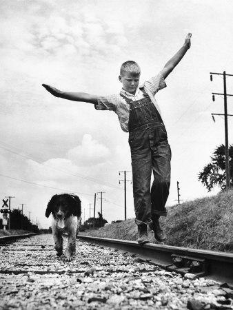 Larry Jim Holm with Dunk, His Spaniel Collie Mix, Walking Rail of Railroad Tracks in Rural Area