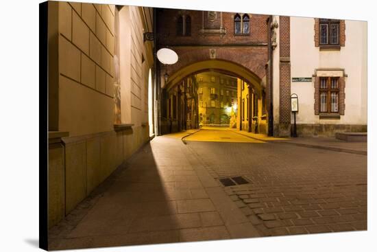 Mysterious Narrow Alley with Lanterns in Krakow at Night-dziewul-Stretched Canvas