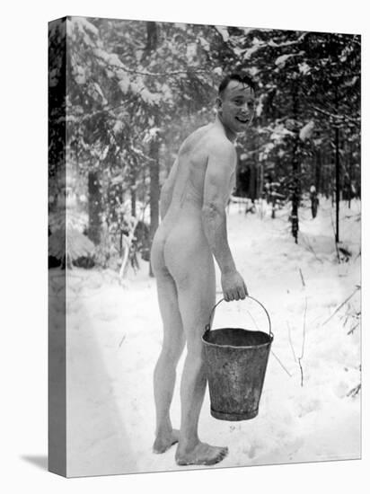 Naked Finnish Soldier Carrying Bucket of Water Back to Friends Enjoying Sauna Bath Nearby-Carl Mydans-Stretched Canvas