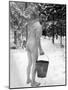 Naked Finnish Soldier Carrying Bucket of Water Back to Friends Enjoying Sauna Bath Nearby-Carl Mydans-Mounted Photographic Print