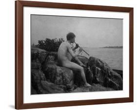 Naked Man Playing His Pipe Photograph-Lantern Press-Framed Art Print