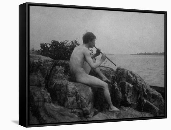 Naked Man Playing His Pipe Photograph-Lantern Press-Framed Stretched Canvas