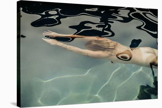 Naked woman diving in swimming pool-Panoramic Images-Stretched Canvas