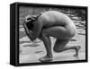 Naked woman posing on edge of swimming pool-Panoramic Images-Framed Stretched Canvas