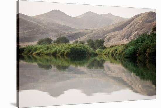 Namibia, Kaokoveld Conservation Area, Kunene River. Greenery along the banks of the Kunene River.-Ellen Goff-Stretched Canvas