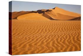 Namibia, Namib-Naukluft National Park, Sossusvlei. Scenic red dunes with wind driven patterns.-Ellen Goff-Stretched Canvas