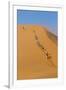 Namibia, Namib-Naukluft National Park, Sossusvlei. Tourists climbing Dune 45.-Ellen Goff-Framed Premium Photographic Print