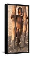 Namibia, Opuwo. Young Himba child in late afternoon light.-Wendy Kaveney-Framed Stretched Canvas