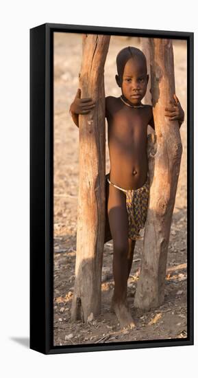 Namibia, Opuwo. Young Himba child in late afternoon light.-Wendy Kaveney-Framed Stretched Canvas