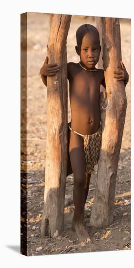 Namibia, Opuwo. Young Himba child in late afternoon light.-Wendy Kaveney-Stretched Canvas