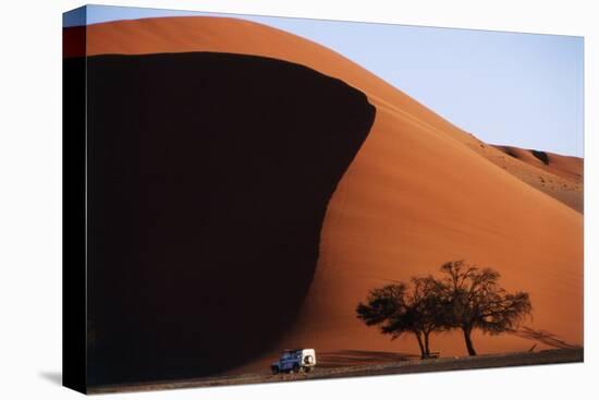 Namibia, Sossusvlei, Namib-Naukluft NP, Dune and Land Rover, Sunset-Walter Bibikow-Stretched Canvas