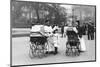 Nannies and Children Strolling in Park-null-Mounted Photographic Print