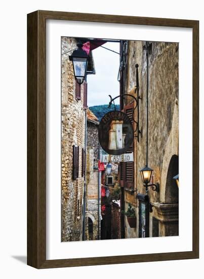 Narrow Medieval Street with Signs and Lamps, Sermoneta, Italy-George Oze-Framed Photographic Print