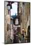 Narrow Medieval Street with Signs and Lamps, Sermoneta, Italy-George Oze-Mounted Photographic Print