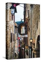 Narrow Medieval Street with Signs and Lamps, Sermoneta, Italy-George Oze-Stretched Canvas