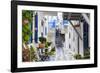 Narrow street, whitewashed buildings with blue paint work, flowers, Mykonos Town (Chora), Mykonos,-Eleanor Scriven-Framed Photographic Print