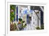 Narrow street, whitewashed buildings with blue paint work, flowers, Mykonos Town (Chora), Mykonos,-Eleanor Scriven-Framed Photographic Print