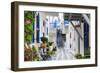 Narrow street, whitewashed buildings with blue paint work, flowers, Mykonos Town (Chora), Mykonos,-Eleanor Scriven-Framed Photographic Print