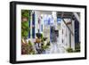 Narrow street, whitewashed buildings with blue paint work, flowers, Mykonos Town (Chora), Mykonos,-Eleanor Scriven-Framed Photographic Print