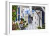 Narrow street, whitewashed buildings with blue paint work, flowers, Mykonos Town (Chora), Mykonos,-Eleanor Scriven-Framed Photographic Print